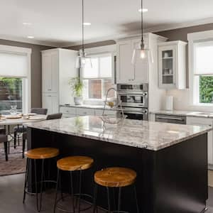 A kitchen in new luxury home with island