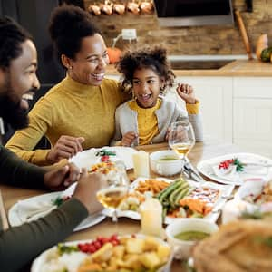 family together eating during the holidays 