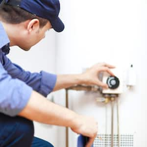 Man fixing water heater