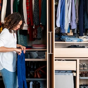 woman clearing out wardrobe 