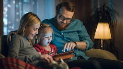 Parents spending leisure time with their daughter 