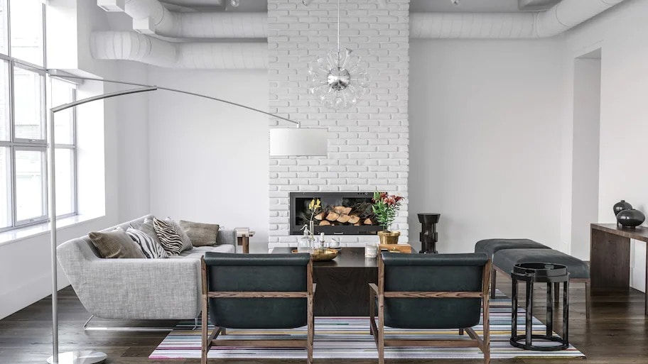 White painted brick fireplace in modern living room