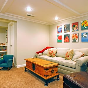 A play room in a white basement living room