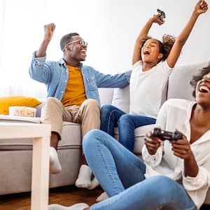 family playing video games in living room