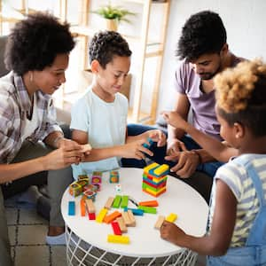 Family playing game on table