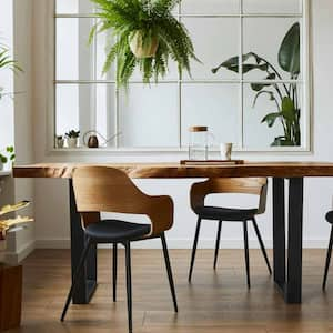 A dining area in a house with wooden floors