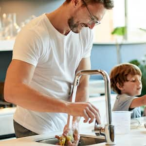 father and son baking together at home