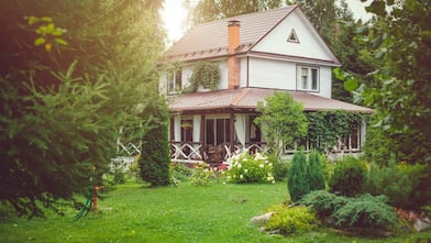 A country house with a green back yard