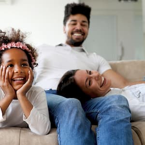 A happy family on a couch