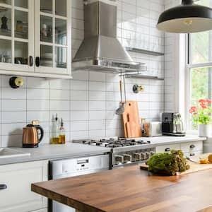 A modern kitchen with a range hoods