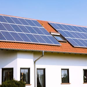 A house with its roof covered with solar panels