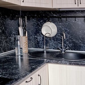 White cabinets with black marble pattern laminate countertops