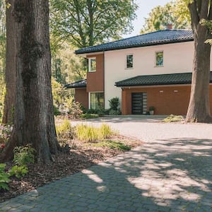 A beautiful house with trees in its front yard