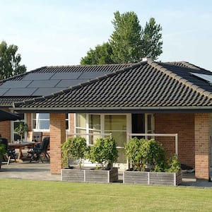 Suburban brick house with solar panels on the roof