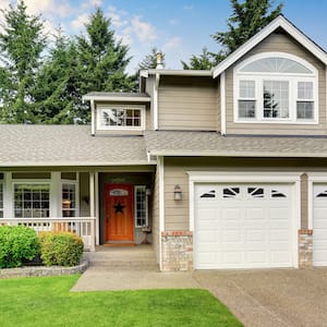 exterior of home with two garage doors 