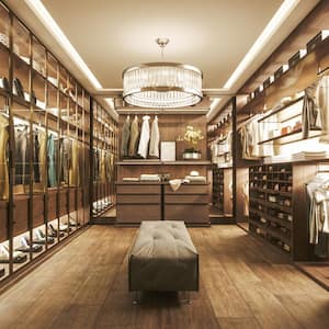 A luxurious walk-in closet with a chandelier