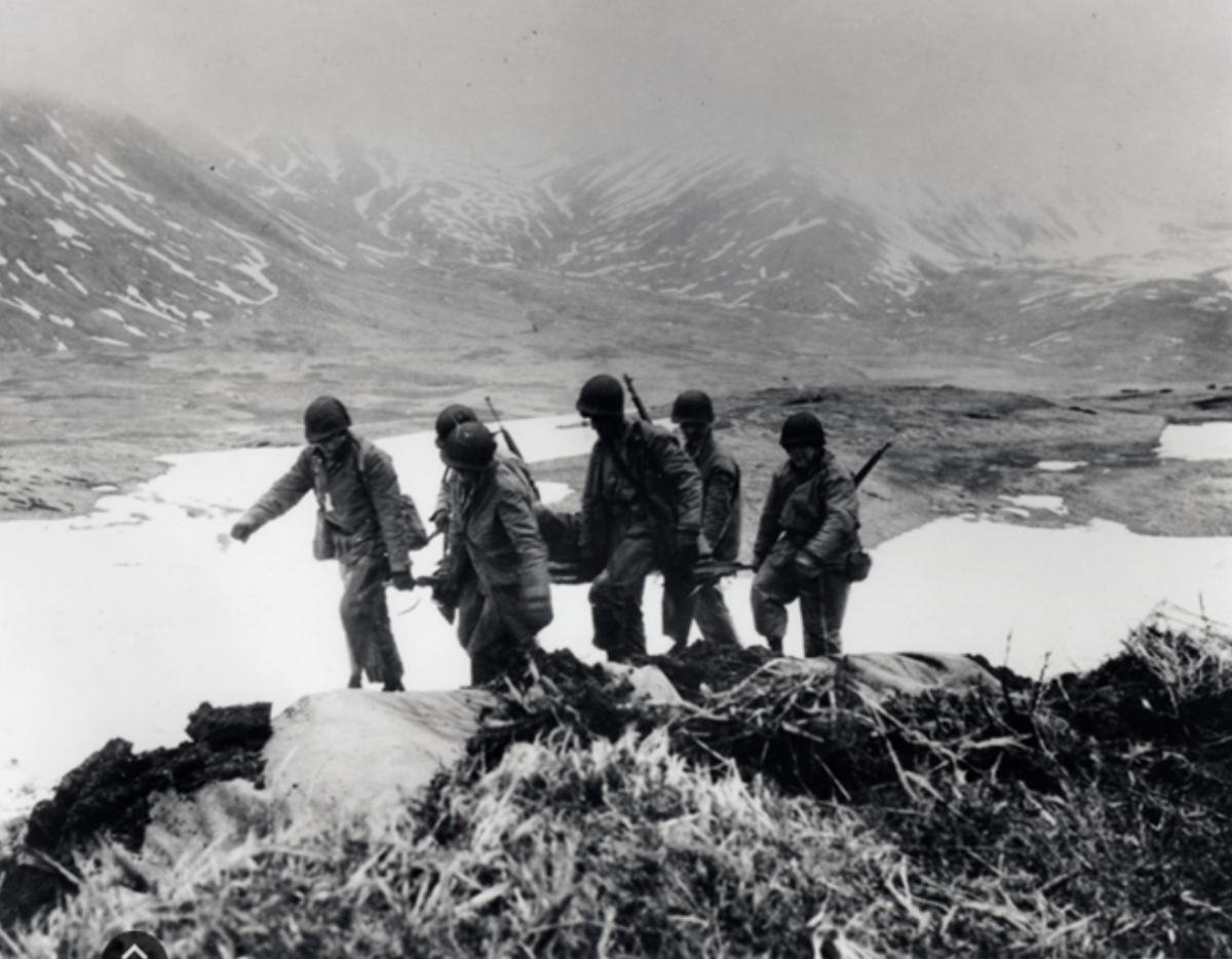 American troops during the Battle of Attu attempt to reclaim the Aleutian island from Japanese invaders.