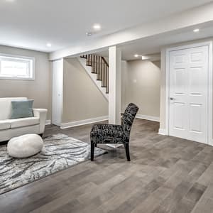 Renovated basement with new furniture and laminate flooring