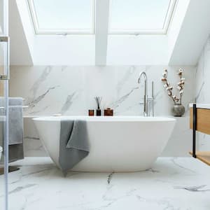 Bright bathroom with marble panels and bathtub