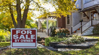 For Sale sign in front of Residence