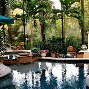 A luxurious lanai patio with an indoor pool