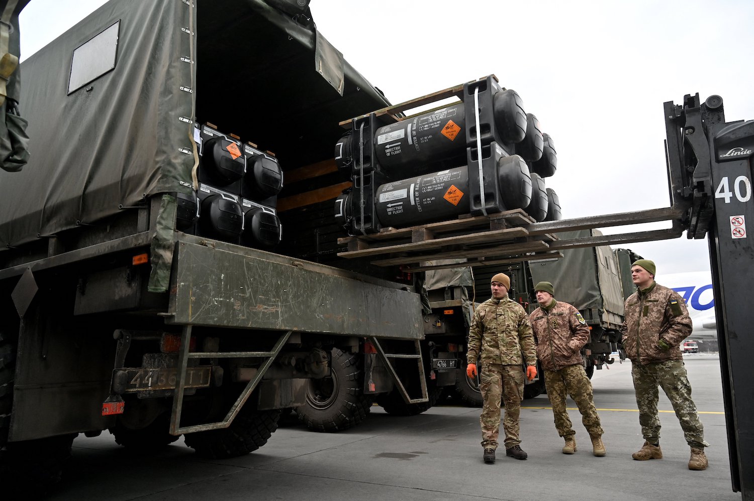 Ukrainian soldiers load a truck with a U.S.-made FGM-148 Javelin anti-tank missile on its delivery.