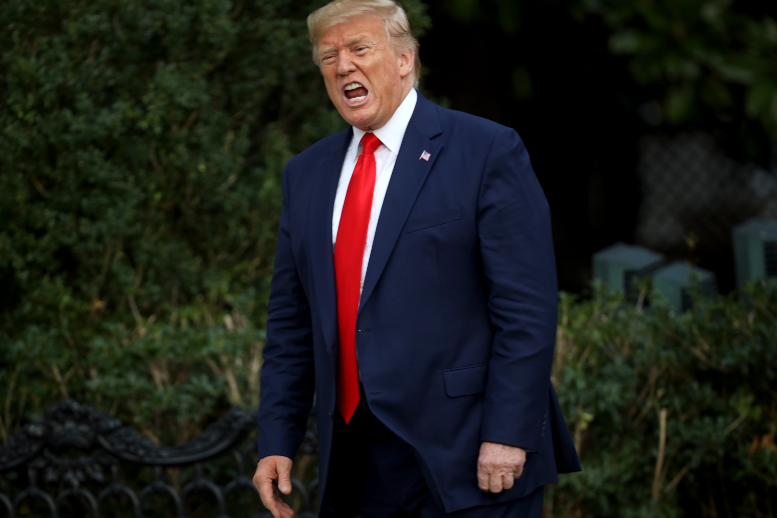 Donald Trump shouts at members of the media as he returns to the White House on October 3, 2019 in Washington.