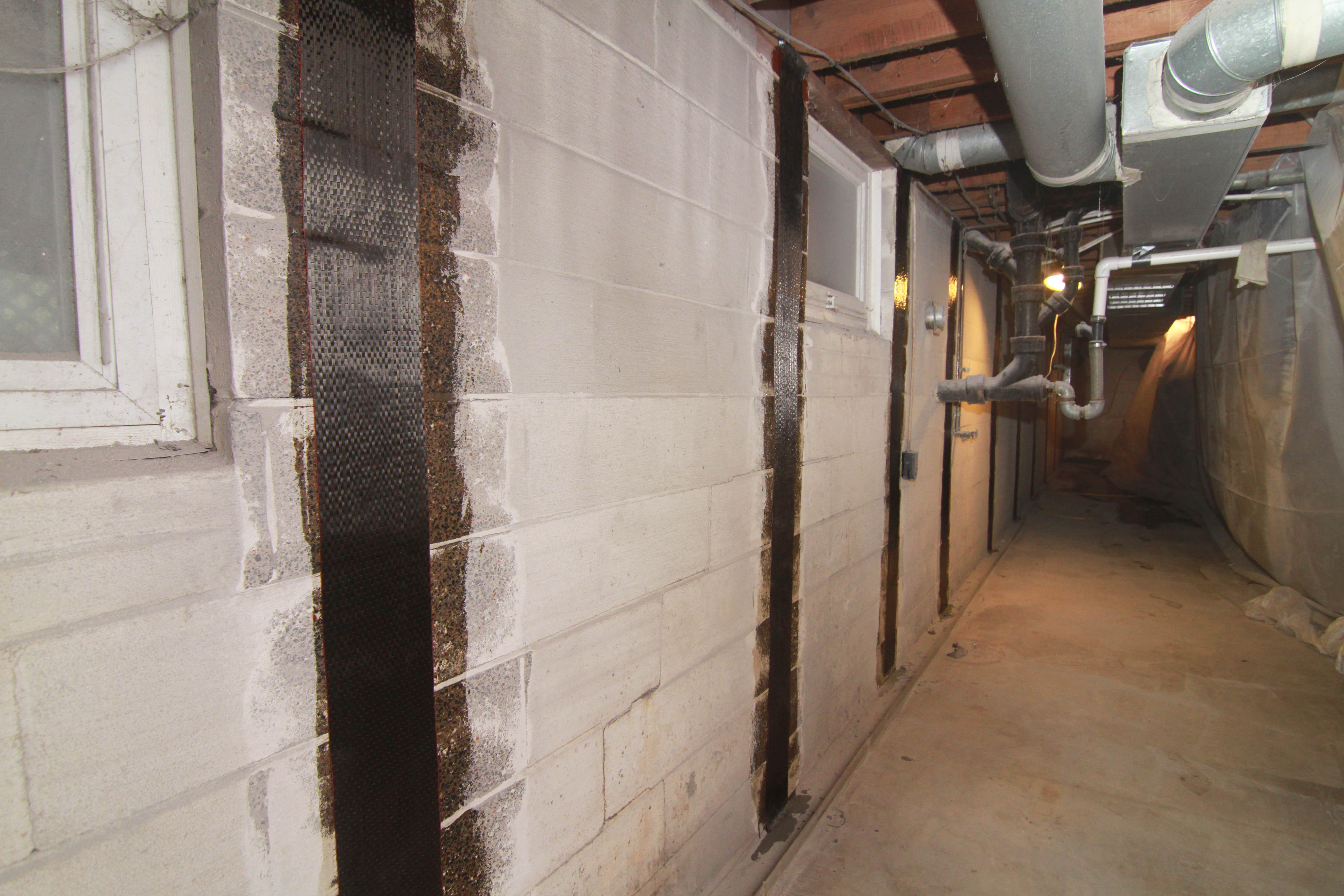 Carbon fiber support installed on concrete basement wall