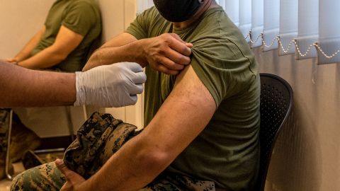  A United States Marine prepares to receive the Moderna coronavirus vaccine at Camp Hansen on April 28, 2021 in Kin, Japan. 