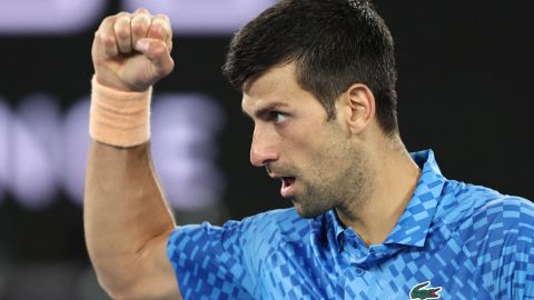 Serbia's Novak Djokovic reacts on a point against Spain's Roberto Carballes Baena during their men's singles match on day two of the Australian Open tennis tournament in Melbourne on January 17, 2023. - -- IMAGE RESTRICTED TO EDITORIAL USE - STRICTLY NO COMMERCIAL USE -- (Photo by Martin KEEP / AFP) / -- IMAGE RESTRICTED TO EDITORIAL USE - STRICTLY NO COMMERCIAL USE -- (Photo by MARTIN KEEP/AFP via Getty Images)