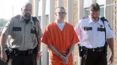 John LaDue is escorted to the Waseca County Courthouse for his sentencing hearing Monday, Oct. 19, 2015, in Waseca, Minn. LaDue, who was charged more than a year and a half ago in a plot to bomb his Waseca school, was sentenced Monday to up to 10 years of probation and treatment at a secured autism spectrum disorder facility in Georgia. (Pat Christman/Mankato Free Press via AP)