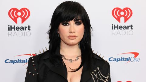 Demi Lovato wore a bondage-style outfit on a large cushioned cross in the image which was deemed to be offensive.