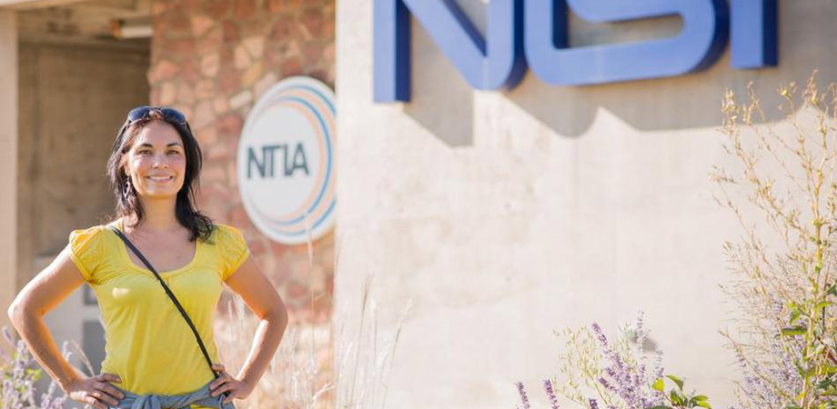 Tara stands proudly in front of the NIST building. 