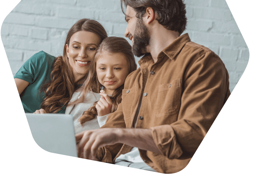 Parents and daughter using their laptop