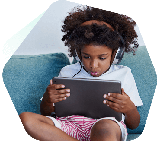 Boy watching YouTube safely on a laptop using Kaspersky Safe Kids