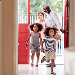 A family walks through front door