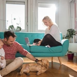 family hanging out with dog at home