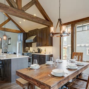  kitchen dining area with exposed wood beams on ceiling
