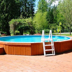 Above ground swimming pool with a wooden deck