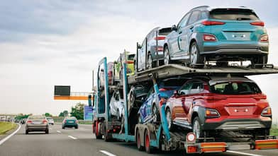 Cars carrier truck at asphalt highway road