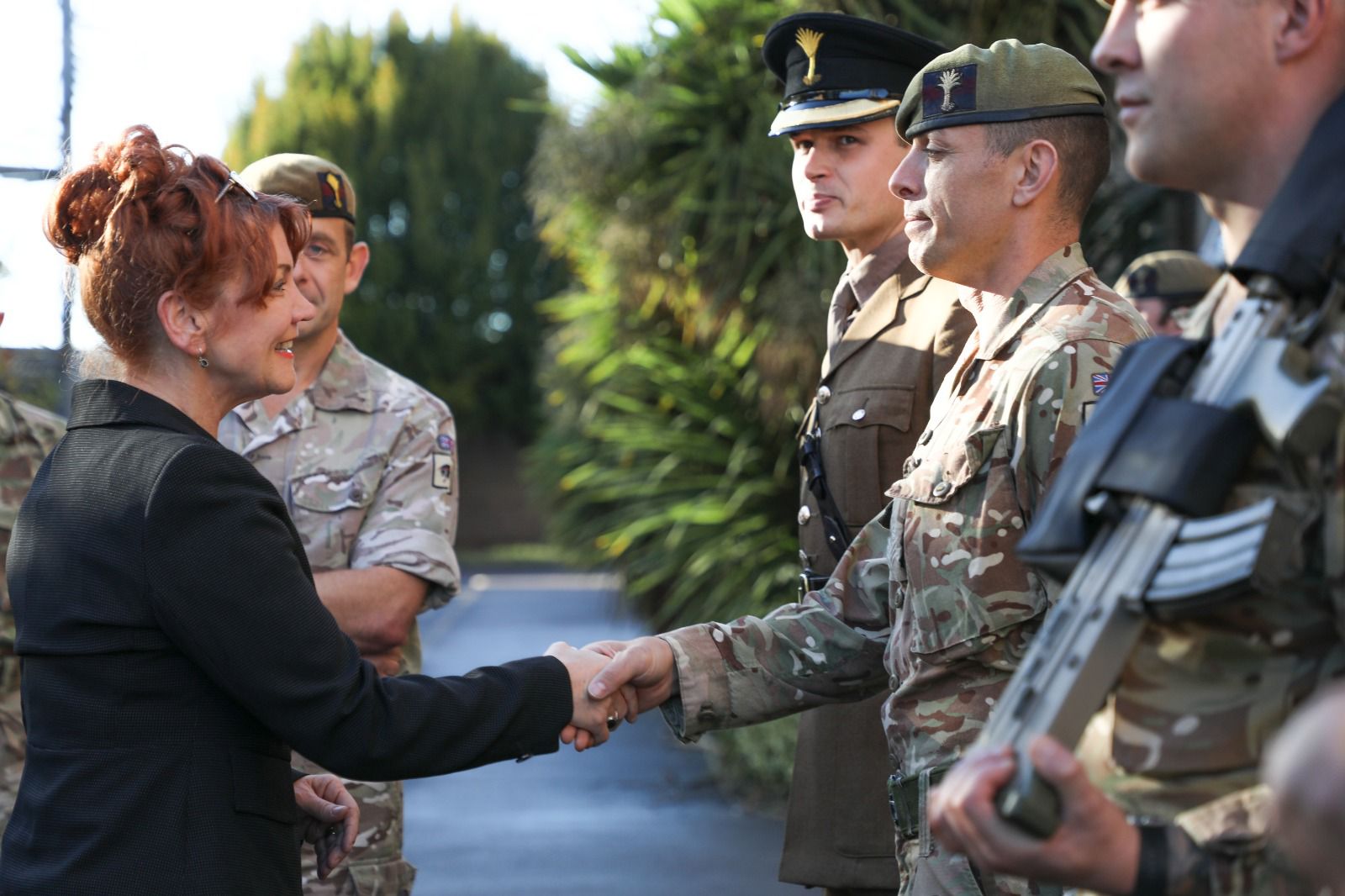 Defence Minister Sarah Atherton being greeted at the Barracks.