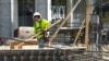 FILE - People work at a construction site in Miami, Jan. 24, 2023.