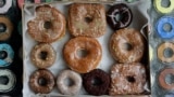 In this Jan. 12, 2007 file photo, a box of transfat-free donuts sit in the front window of the shop on New York's Lower East Side. (AP Photo/Richard Drew, File)