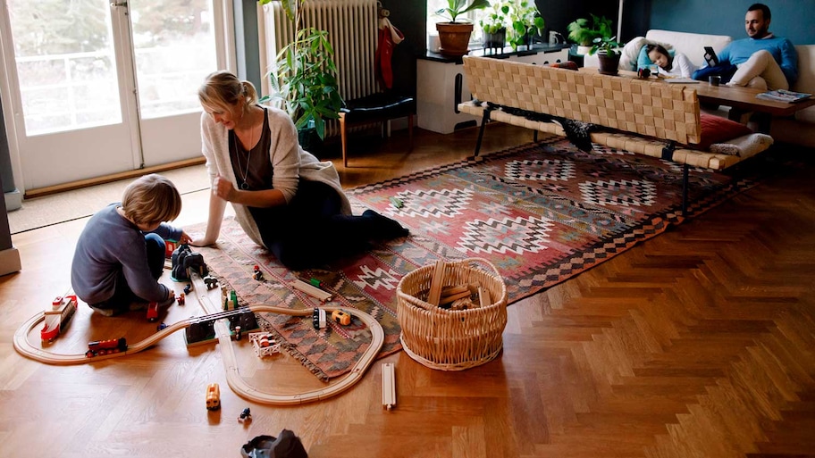 Mother and son playing on the living room floor