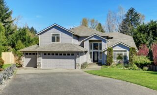 Traditional blue home exterior with wood siding