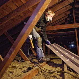 insulation professional working in attic