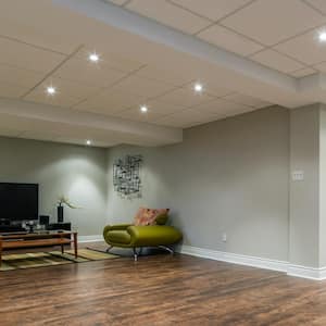 A basement with drop ceiling