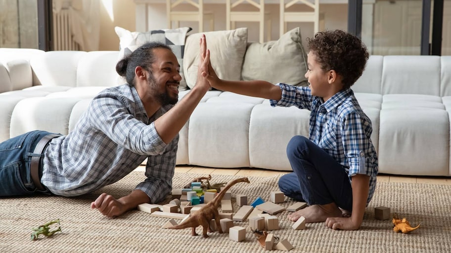 Father and son playing on the floor