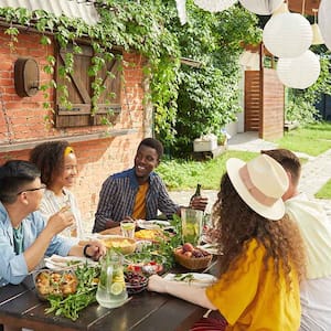 Group of friends having dinner on the patio