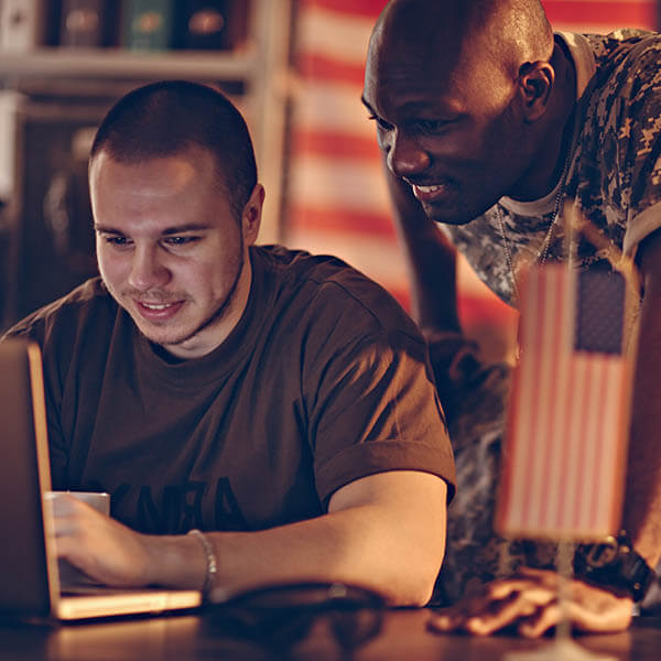 military working on computer